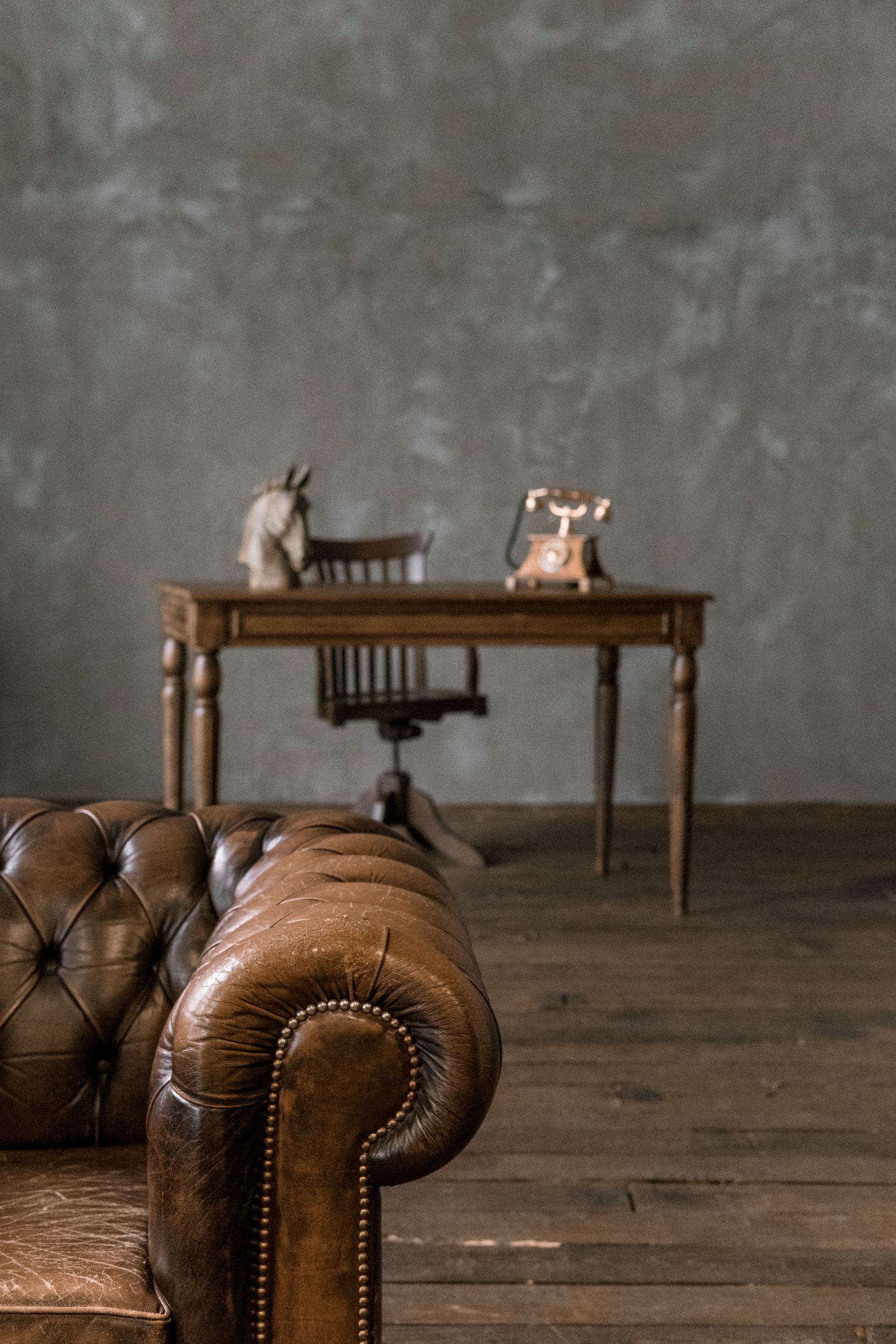 Armrest of Leather Chesterfield Sofa and Retro Furniture