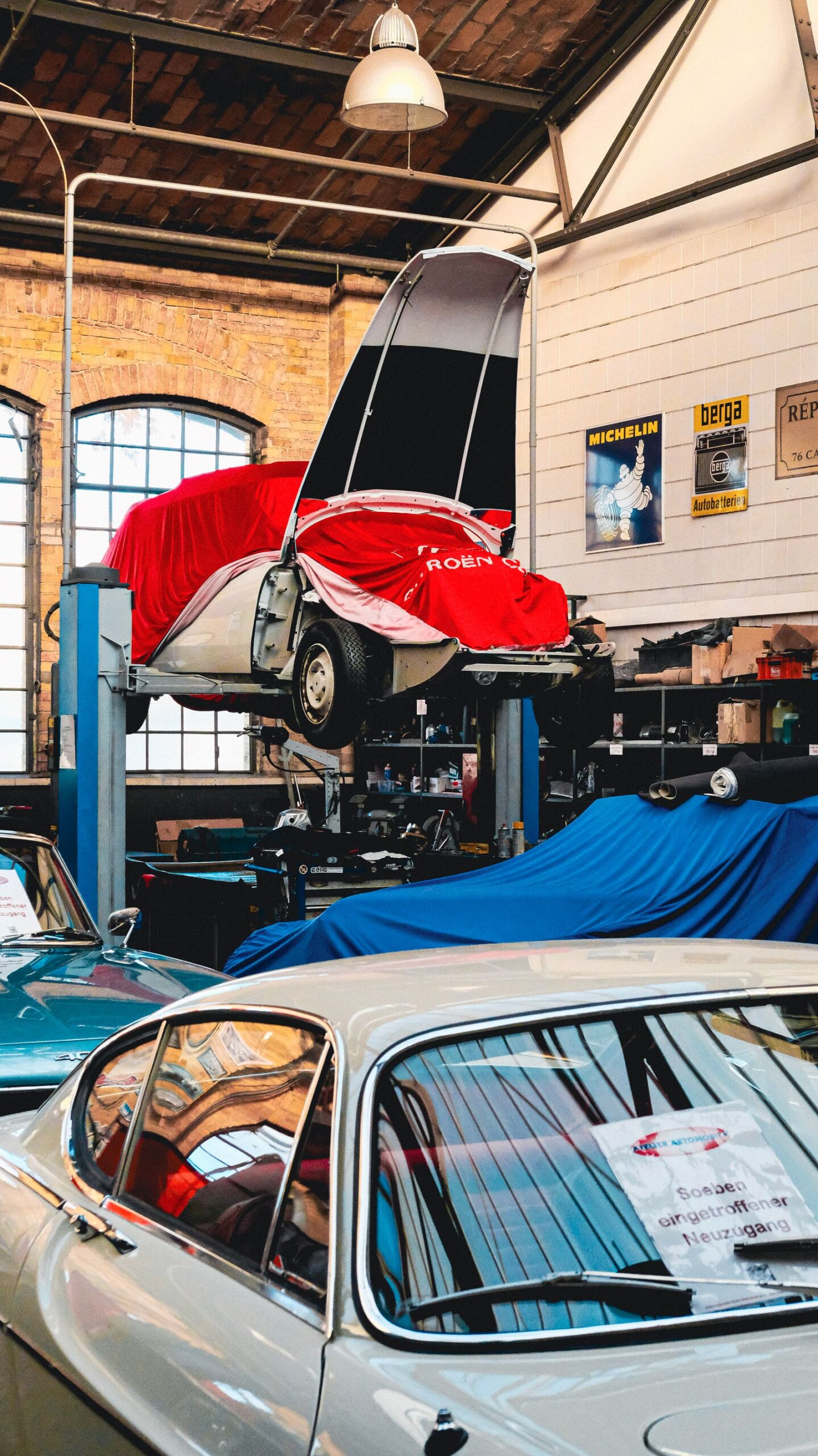 Vintage Car Workshop with Cars on Lifts