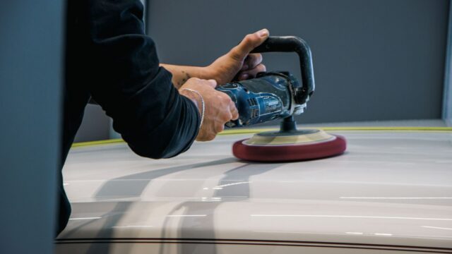 A Person Buffing a Car