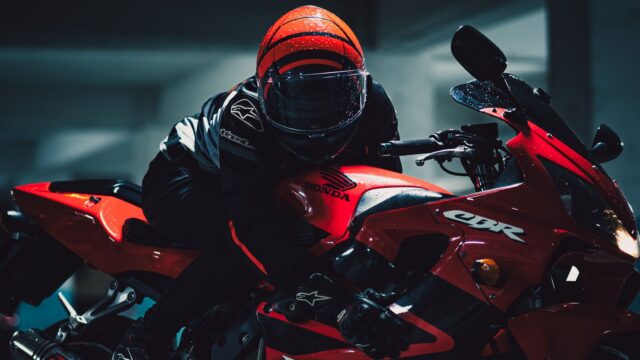 Dynamic Night Shot of Motorcyclist on Red Honda